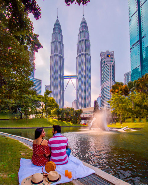 Picnic at the park in front of petronas tower in Kuala Lumpur