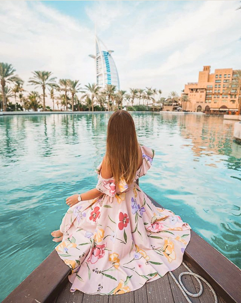 A girl taking a boat ride at Madinat Jumeirah