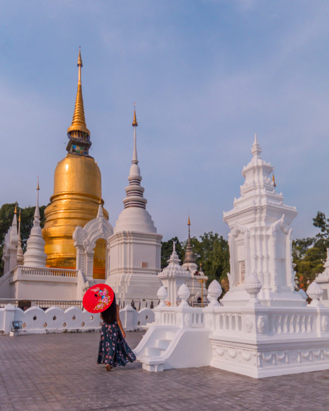 A girl in green dress at the temple complex of Wat suan dok