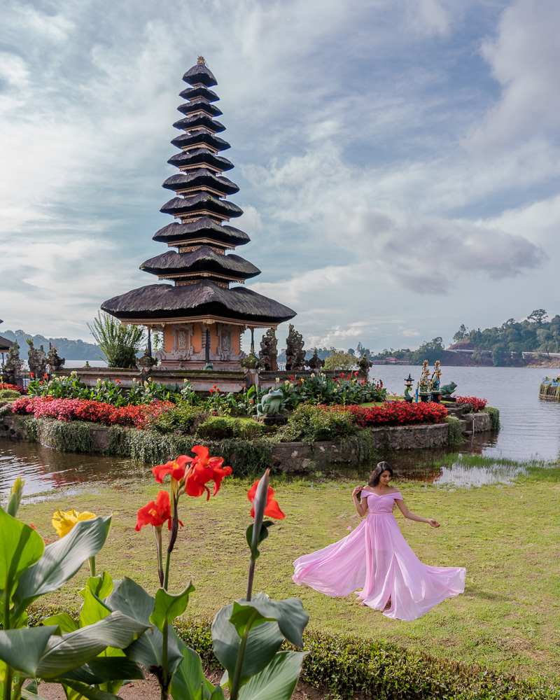 A girl in pink dress at ulun danu bretan temple